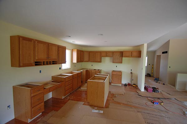 Install cabinets and countertops in a newly built home in Indiana