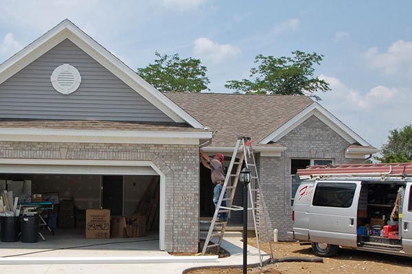 Install gutters in a newly built home in Indiana